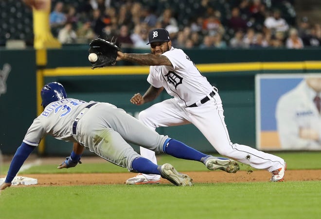 Tigers third baseman Ronny Rodriguez, right, waits on the throw from catcher James McCann to tag out Kansas City Royals' Jorge Bonifacio during the fourth inning on Friday.