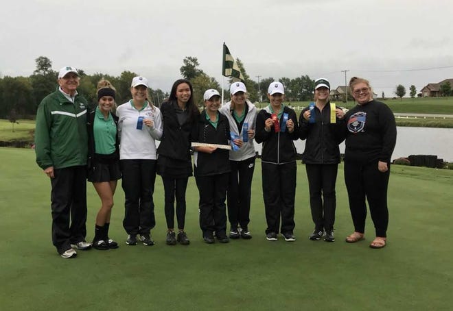 The North girls golf team celebrates its fifth straight regional title.