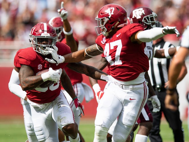 Alabama linebacker Mack Wilson (30) and linebacker Christian Miller (47) celebrate Wilson's interception against Texas A&M In first half action in Tuscaloosa, Ala., on Saturday September 22, 2018.