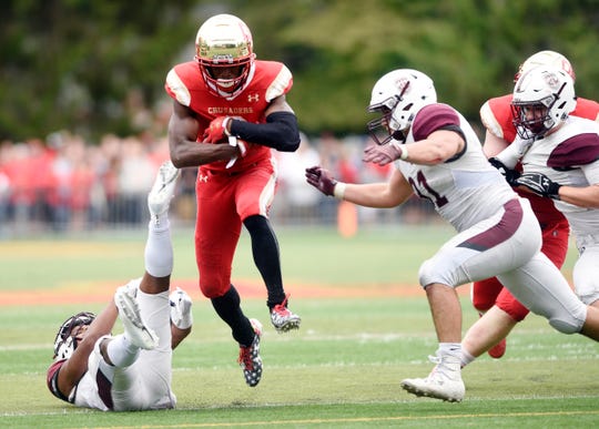 Don Bosco at Bergen Catholic on Saturday, September 22, 2018. BC #6 Rahmir Johnson avoids a tackle in the fourth quarter. 