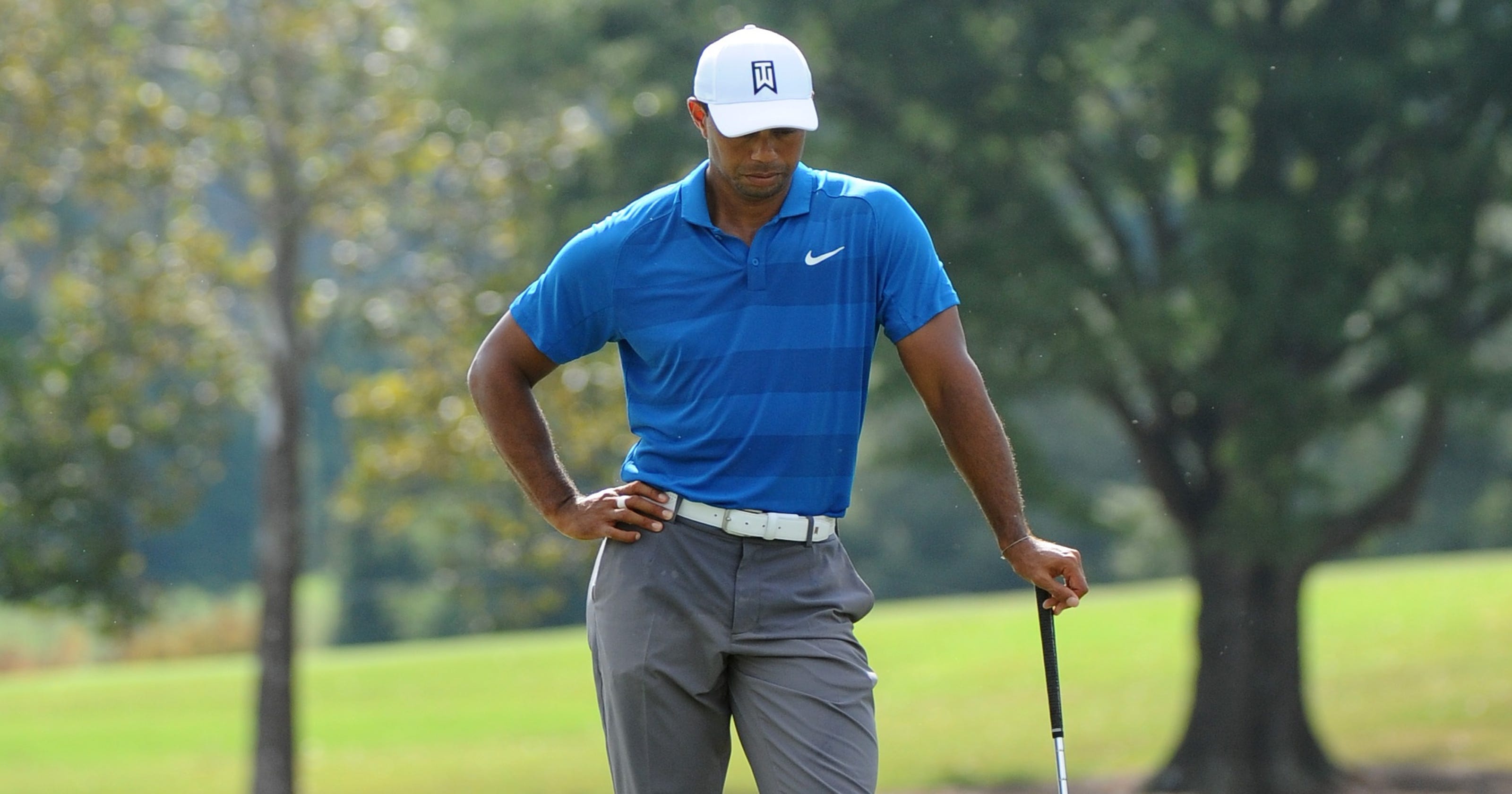 what time does tiger woods tee off on friday