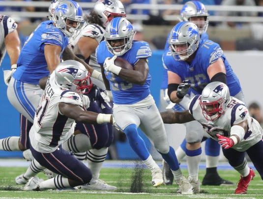Detroit Lions running back Kerryon Johnson runs the ball against the New England Patriots during the second half Sunday, Sept. 23, 2018 at Ford Field.