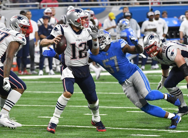Patriots' Tom Brady is sacked by Lions' Eli Harold in the fourth quarter. Harold had two sacks in Detroit's 26-10 victory.