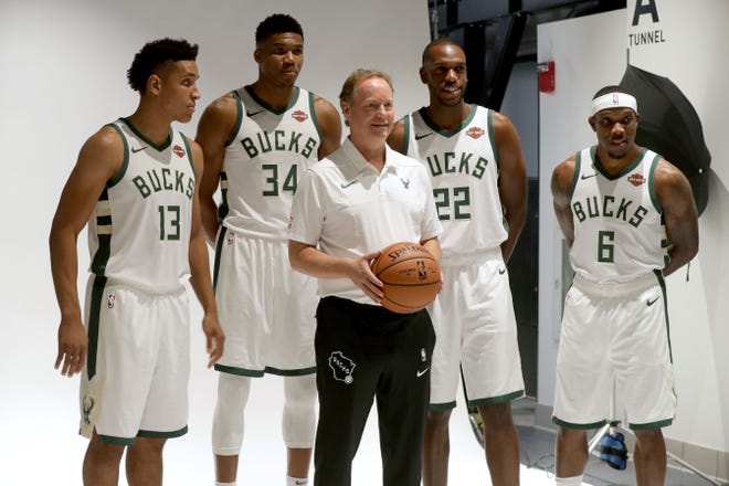 Milwaukee Bucks head coach Mike Budenholzer poses for a photo with (from left) Malcolm Brogdon, Giannis Antetokounmpo, Khris Middleton and Eric Bledsoe.