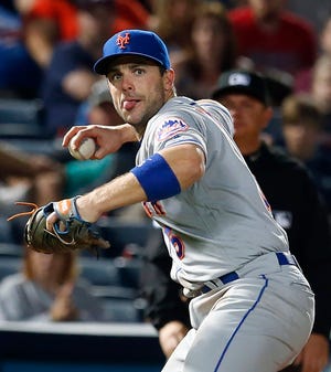 Mets third baseman David Wright throws to first for the out against the Atlanta Braves during the ninth inning of a baseball game, Saturday, April 23, 2016, in Atlanta.