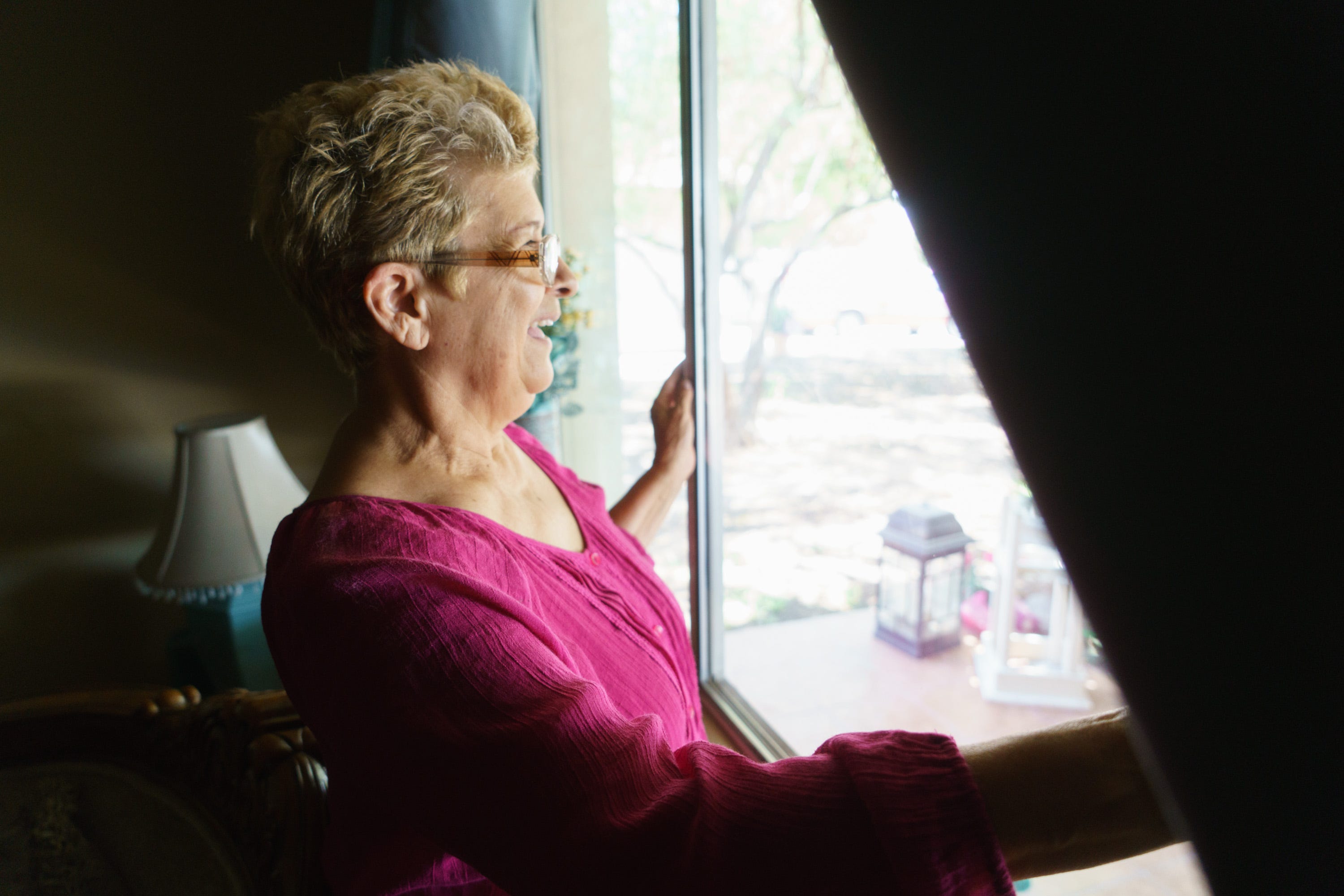 At her home in Calexico, Ernestina Calderón looks outside at her grandchildren.