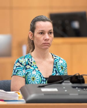 Mary Rice listens Monday during court proceedings in Pensacola. The 38-year-old Milton woman faces one count of first-degree murder and one count of accessory after the fact to first-degree murder in connection to a 2017 murder spree.