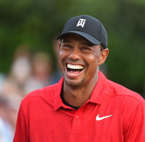Tiger Woods reacts after winning the Tour...