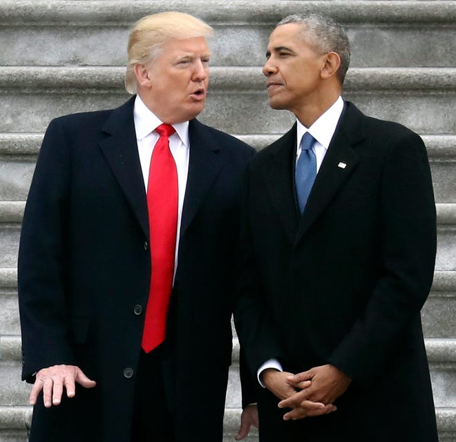 President Donald Trump talks and former President Barack Obama on Capitol Hill in Washington in 2017