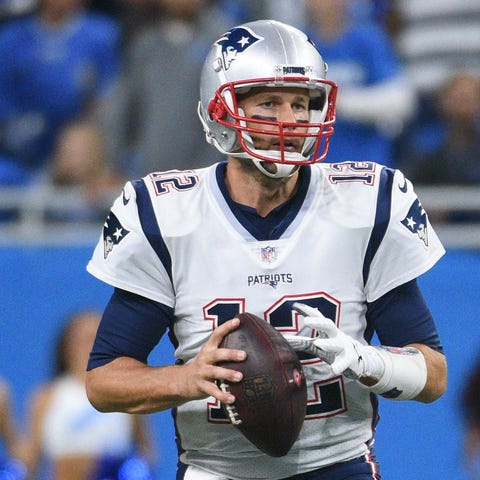 New England Patriots quarterback Tom Brady (12)...