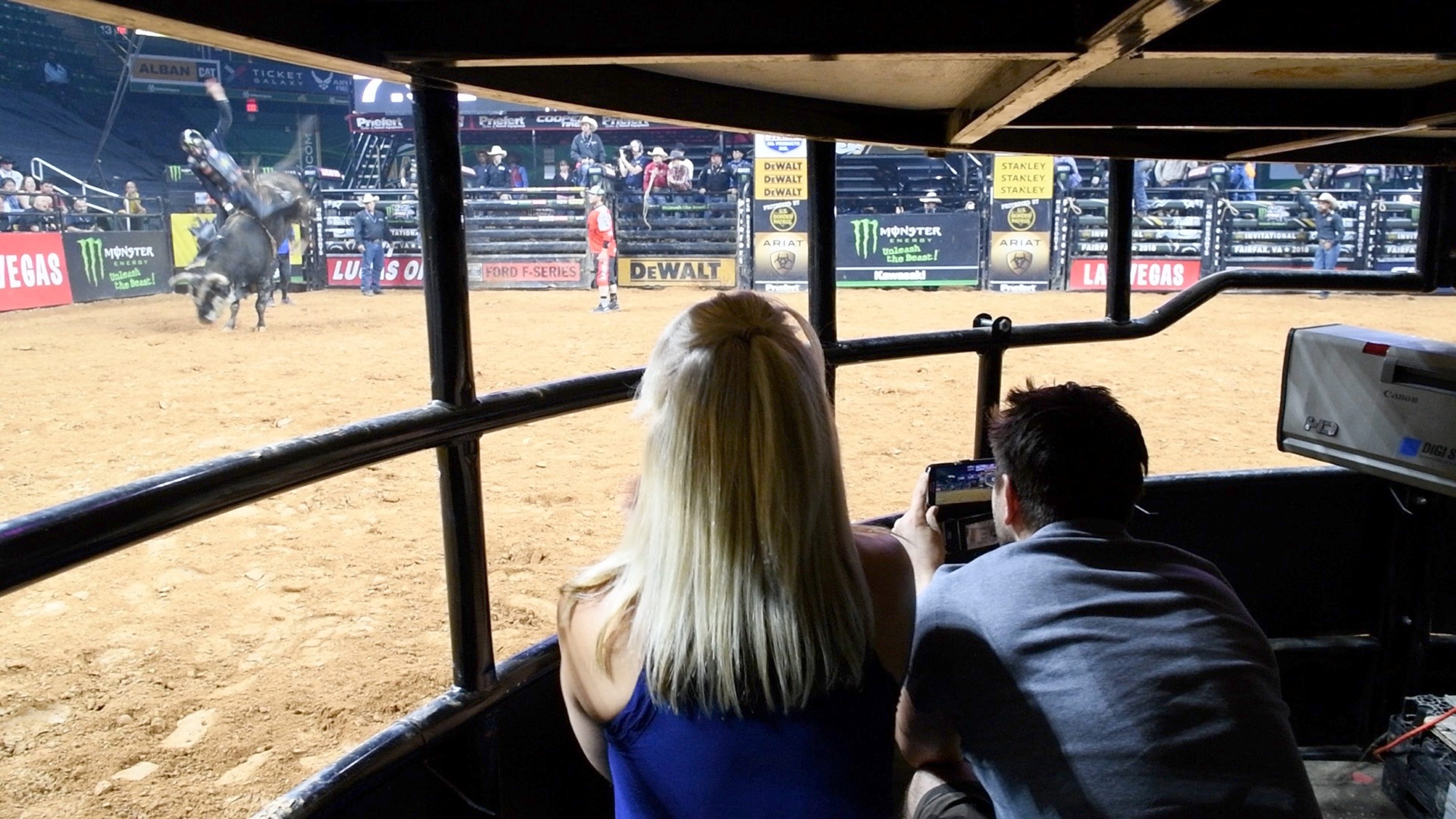 Inside the shark cage at a professional bull riding event