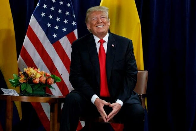 President Donald Trump smiles during a meeting with Colombian President Ivan Duque during the United Nations General Assembly, Tuesday, Sept. 25, 2018, at U.N. Headquarters.