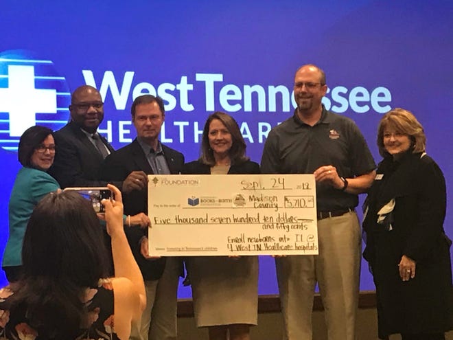West Tennessee Healthcare Foundation officials present a check to Imagination Library officials on Monday at Jackson-Madison County General Hospital.
