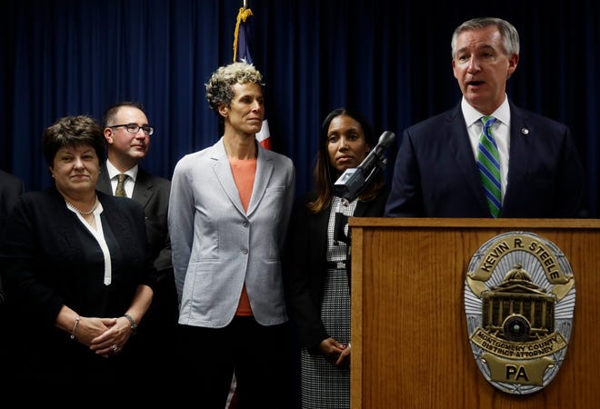 Bill Cosby prosecutor Kevin Steele with Cosby accuser Andrea Constand, center, after the star was convicted on April 26, 2018.