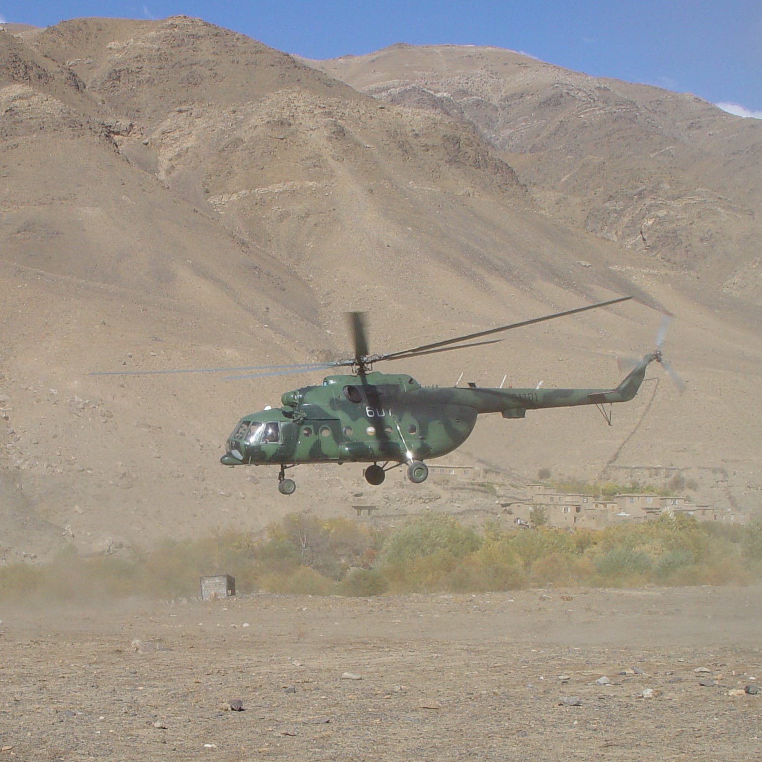 The Mi-17 used by the CIA to land its first team in Afghanistan after 9/11 is seen taking off in the Panjshir Valley in a photo taken between October 2001 and December 2001.