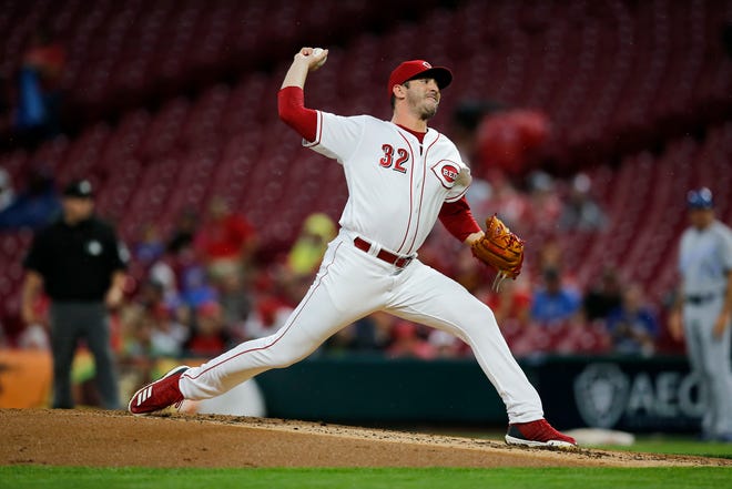 Cincinnati Reds starting pitcher Matt Harvey (32) delivers a pitch in the second inning of the MLB Interleague game between the Cincinnati Reds and the Kansas City Royals at Great American Ball Park in downtown Cincinnati on Tuesday, Sept. 25, 2018.