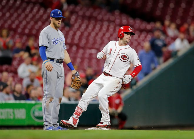 Cincinnati Reds second baseman Scooter Gennett (3) stands up into a triple in the seventh inning of the MLB Interleague game between the Cincinnati Reds and the Kansas City Royals at Great American Ball Park in downtown Cincinnati on Tuesday, Sept. 25, 2018. The Reds lost 4-3 to begin the final home stand of the season. 