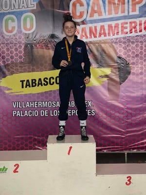 Maddi Wellen poses with her gold medal that she earned at the Pan American U15 Girls freestyle wrestling championships held in Villahermosa, Mexico on Sept. 14, 2018.