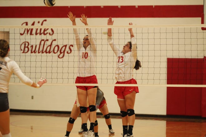 Miles High School's Tycie Lange (10) and Libby Crouch (13) try to block a shot against Water Valley on Tuesday, Sept. 25, 2018.