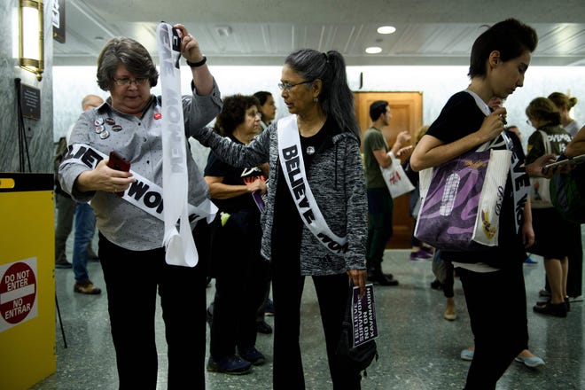 Activists walk through the halls of Dirksen Senate Office Building during protests against Judge Brett Kavanaugh on Capitol Hill September 26, 2018 in Washington, DC. - The US Senate Judiciary Committee has scheduled for Friday a preliminary vote on the nomination of Supreme Court pick Brett Kavanaugh, who is under fire over claims of sexual assault in his youth. (Photo by Brendan Smialowski / AFP)BRENDAN SMIALOWSKI/AFP/Getty Images ORIG FILE ID: AFP_19H1NL