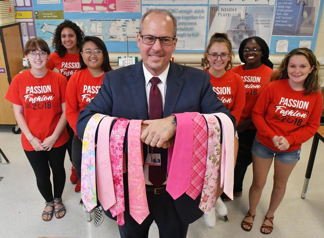 Brevard County Schools Superintendent Mark Mullins receives several originally made pink ties from students, including, left to right, Hannah MacKenzie, Destanie Genao, Juliane Parguian, Skylar Lefever, Demyia Biggs, and Patience Logsdon at Palm Bay High. This is for Breast Cancer Awareness Month in October.
