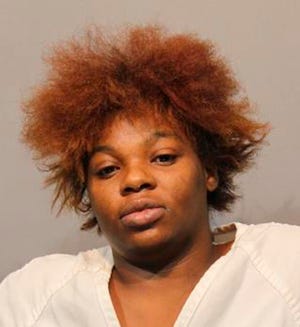 This Sept. 25, 2018, booking photo released by Michigan State Police shows Andre Edwards. Edwards has been arraigned on murder and other charges after her SUV slammed into the rear of a disabled school bus, killing two people. Michigan State Police say a fugitive team arrested 25-year-old Andre Edwards in suburban Detroit on Tuesday. She faces two counts of second-degree murder, four counts of operating while intoxicated causing death, three counts of child abuse and other charges.