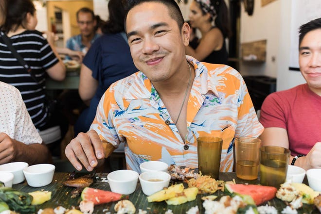 A diner enjoys the food at a previous Sarap kamayan feast.