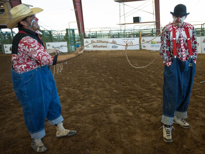 Josh Hernandez, left, ropes his friend and fellow rodeo clown Ethan Johnson, right, in the Kids and Fan Zone at the Southern New Mexico State Fair and Rodeo, Wednesday September 26, 2018.