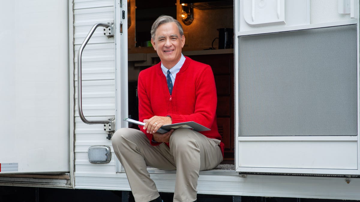Tom Hanks, shown here on the set of his upcoming film, is officially in Mister Rogers' red cardigan.