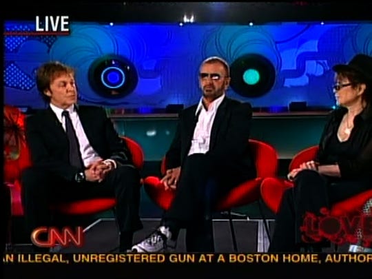 Beatles Paul McCartney and Ringo Star with Yoko Ono on Larry King's CNN show on July 27, 2007.