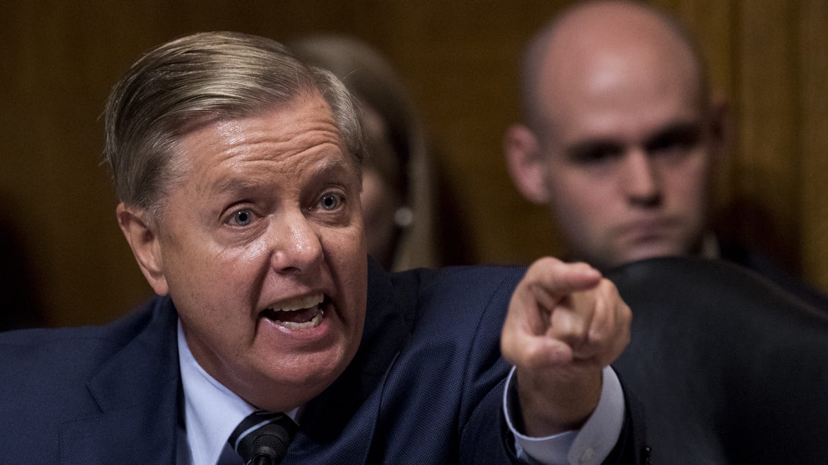 Sen. Lindsey Graham, R-S.C., points at the Democrats as he defends Judge Brett Kavanaugh during the Senate Judiciary Committee hearing on his nomination be an associate justice of the Supreme Court of the United States, on Capitol Hill September 27, 2018 in Washington, DC.