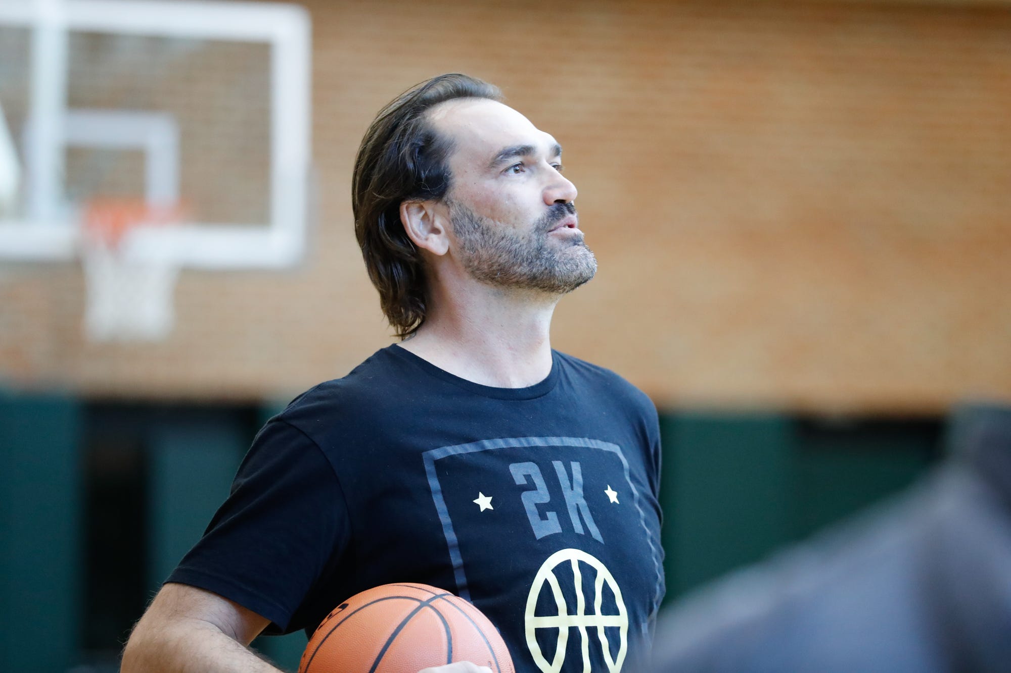 Former Indiana Pacer Scott Pollard plays a game of horse with members of IFD and IMPD at Bankers Life Fieldhouse in preparation for the fifth-annual Hoops and Heroes charity basketball game benefitting The Julian Center, Friday, Sept. 27, 2018. The main event will take place on Saturday, October 6 at 6:15 p.m. at the University of Indianapolis.