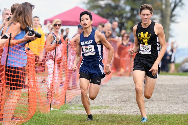 Garret Mountain Back To the Mountain meet on Saturday, Sept. 15, 2018.Joey Cummings (right), of West Milford, on his way to finishing first and David Perry, of Ramsey, on his way to finishing second.