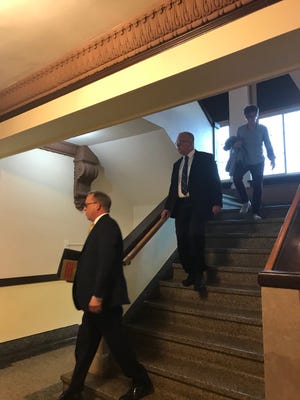 Dan Guericke, center, has pleaded guilty to falsification of evidence in charges related to a money-funneling scheme at a Platte education cooperative