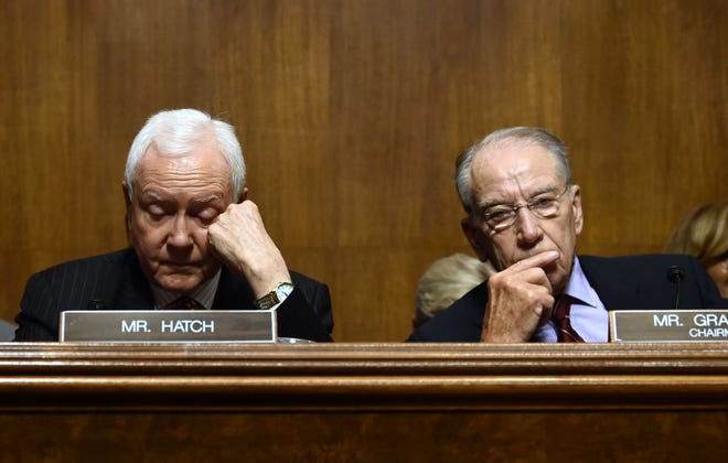 Senate Judiciary Committee chair Chuck Grassley and Senator Orrin Hatch wait during a hearing on Capitol Hill in Washington, DC on September 28, 2018, on the nomination of Brett M. Kavanaugh to be an associate justice of the Supreme Court of the United States. - Kavanaugh's contentious Supreme Court nomination will be put to an initial vote Friday, the day after a dramatic Senate hearing saw the judge furiously fight back against sexual assault allegations recounted in harrowing detail by his accuser. (Photo by Brendan SMIALOWSKI / AFP)BRENDAN SMIALOWSKI/AFP/Getty Images ORIG FILE ID: AFP_19K5B1