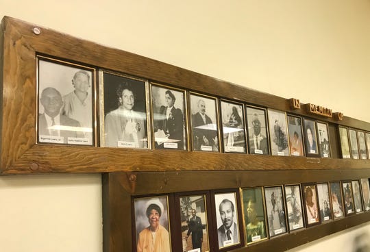 Pictures of Kelly Guerra's great-grandparents, top left, and grandmother center left, appear on the church's memory wall.
