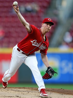 Reds pitcher Anthony DeSclafani delivers in the first inning against the  Pirates on Friday at Great American Ball Park.