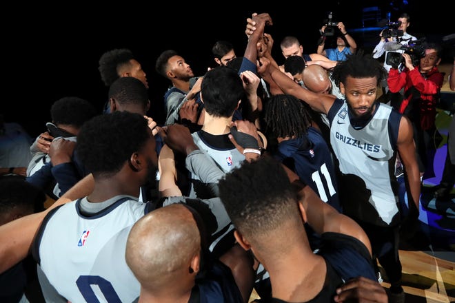 Grizzlies players huddle up before their open practice and scrimmage for fans Saturday at FedExForum.