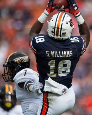 Auburn’s Seth Williams (18) catches a pass and runs into the end zone for a touchdown at Jordan-Hare Stadium in Auburn, Ala., on Saturday, Sept. 29, 2018. Auburn leads Southern Miss 14-3, the game went into a weather delay with 4:27 left in the second quarter.