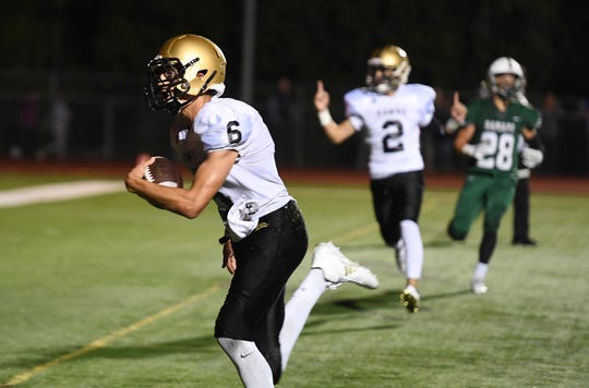 River Dell receiver Jack Racine (6), shown catching a touchdown at Ramapo earlier this season, made another TD grab in the Golden Hawks' playoff win over Pascack Valley on Friday.