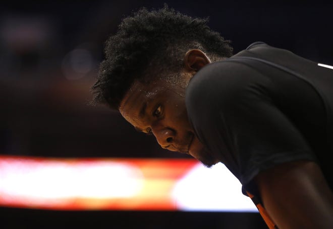 Suns Deandre Ayton looks at the court during an Open Practice at Talking Stick Resort Arena in Phoenix, Ariz. on Sept. 29, 2018.