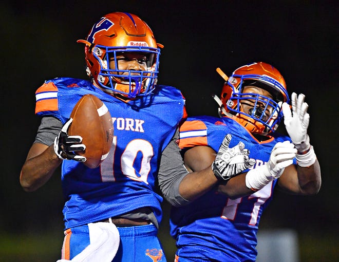 York High's Tyrell Whitt, left, and Anthony Jamison celebrate a touchdown made by Whitt during football action against Dallastown at Smalls Athletic Field in York City, Friday, Sept. 28, 2018. York High would win the game 68-35. Dawn J. Sagert photo