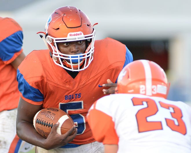 Millville's Tex Thompson carries the ball during Friday night's game against Cherokee at Millville Senior High School, Friday, Sept. 28, 2018.