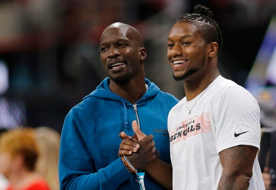 Former Bengals wide receiver Chad Johnson talks with Joe Mixon before the NFL Week 5 game between the Atlanta Falcons and the Cincinnati Bengals at Mercedes-Benz Stadium in Atlanta on Sunday, Sept. 30, 2018.