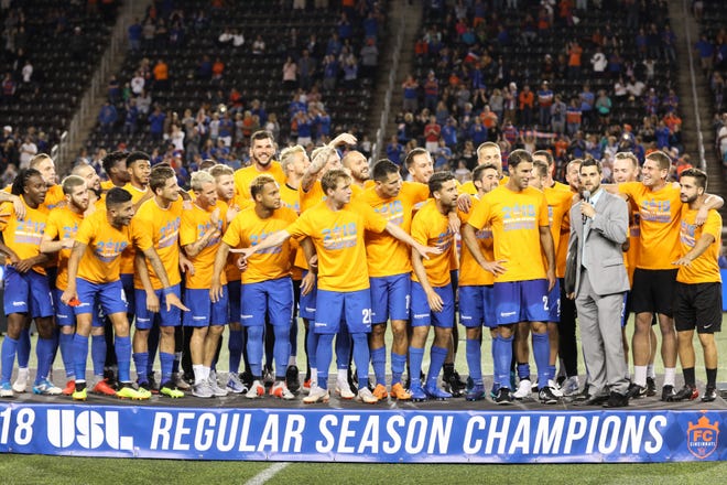 FC Cincinnati players get ready to accept the 2018 USL Regular Season trophy after their match against Indy Eleven at Nippert Stadium on Saturday. FC Cincinnati won the match with a final score of 3-0.