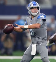 Matthew Stafford looks to pass against the Cowboys in the first quarter.