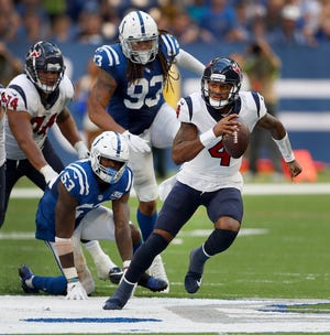 Houston Texans quarterback Deshaun Watson (4) runs away from Indianapolis Colts linebacker Darius Leonard (53) in the second half of their game on Sunday, Sept. 30, 2018. The Indianapolis Colts lost 37-34 in overtime to the Houston Texans. 