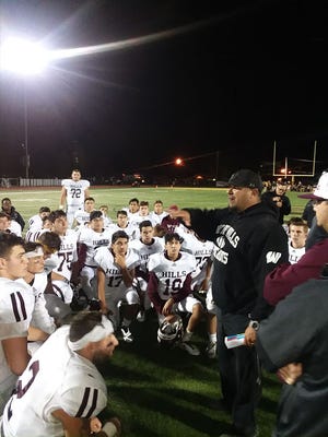 Wayne Hills offensive coordinator John Jacob congratulates the team after a 41-15 victory over West Milford.