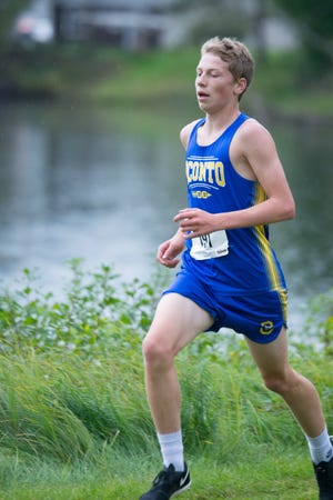 Oconto's Josh Woller takes a commanding lead in the rain and places first at the home cross country meet at Holtwood Park on Tuesday, Sept. 25.