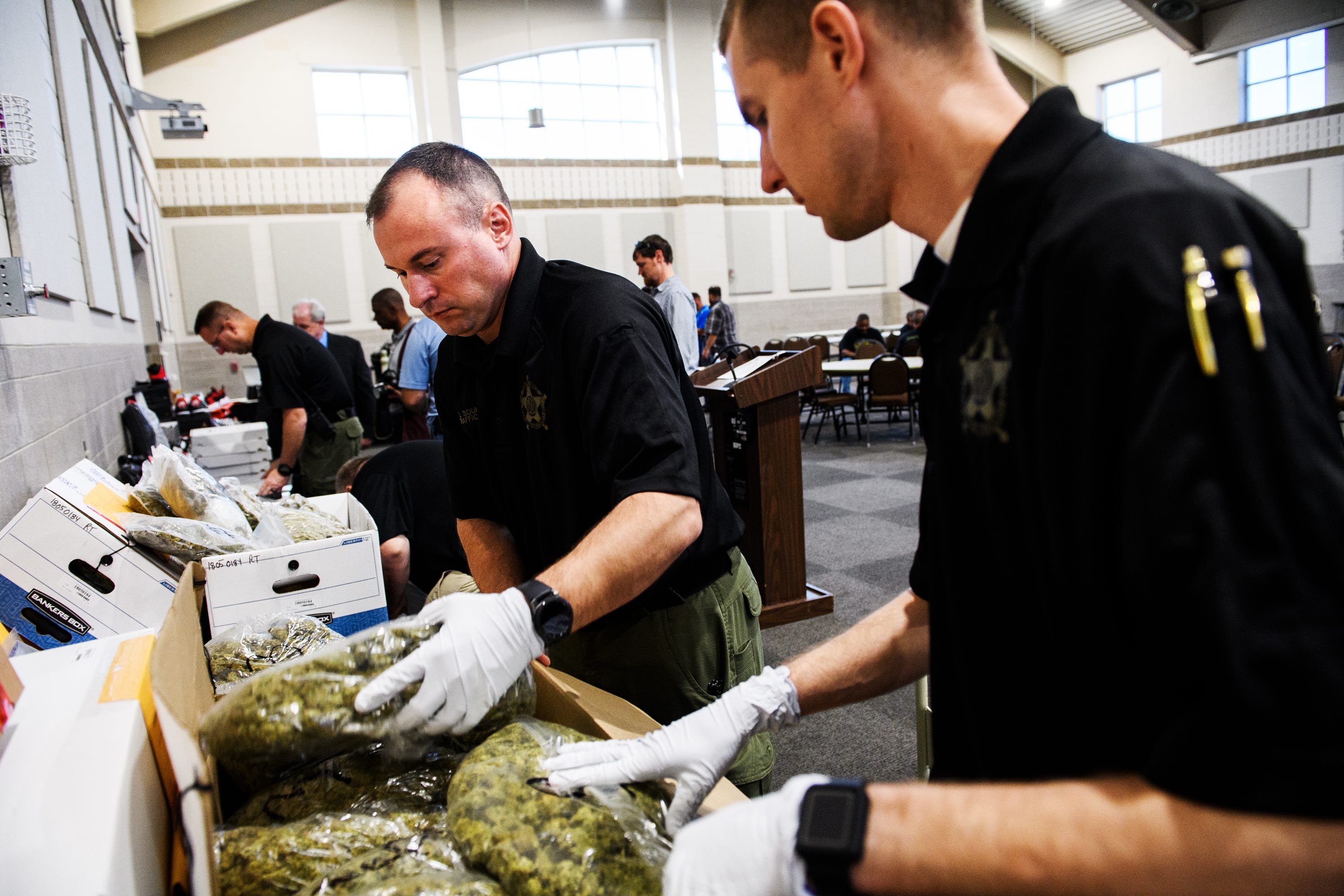 Spartanburg sheriff's deputies pack up bags of marijuana seized during Operation Rolling Thunder on Friday, May 4, 2018. Authorities seized a total 60 pounds of marijuana over four days.